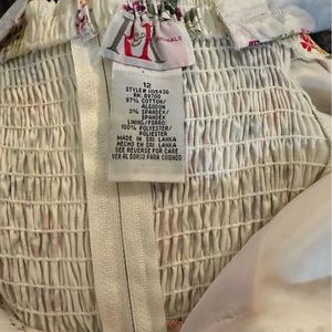 Size 12. Only worn a few times. Beautiful dress